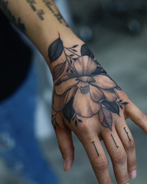 magnolia hand tattoo