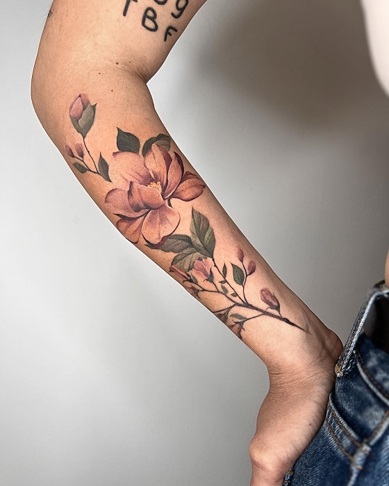 peach magnolia forearm tattoo