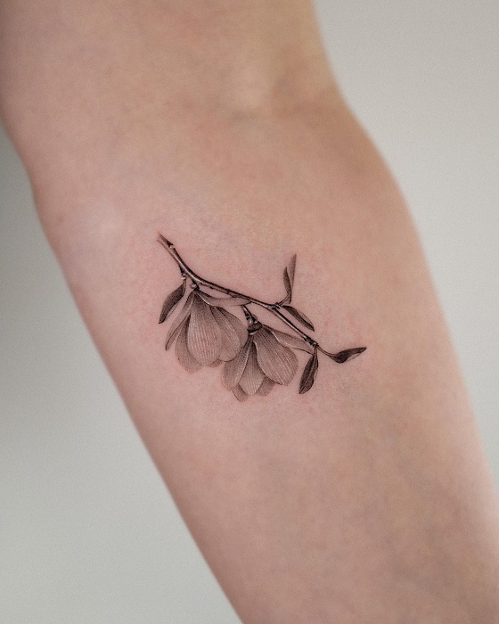small fine line magnolia tattoo
