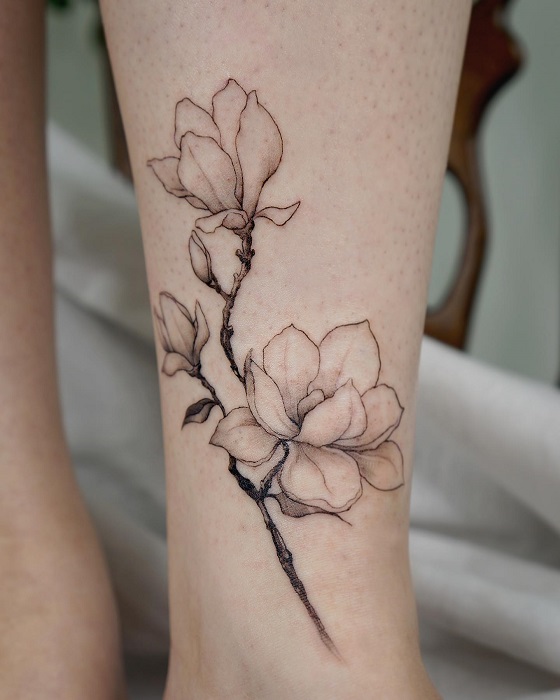 fine line magnolia flower tattoo