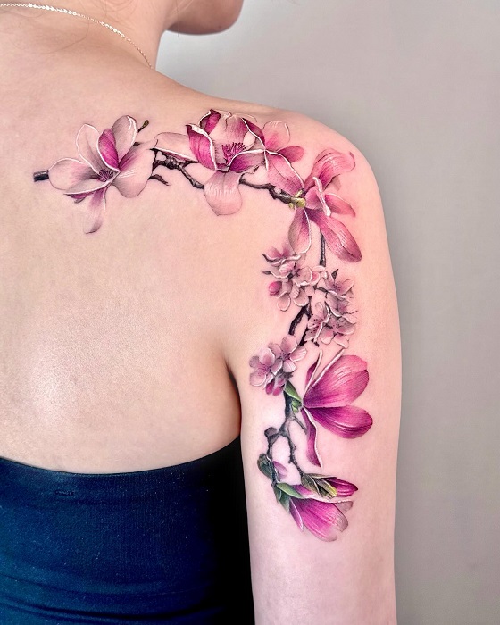 pink magnolia shoulder and upper arm tattoo