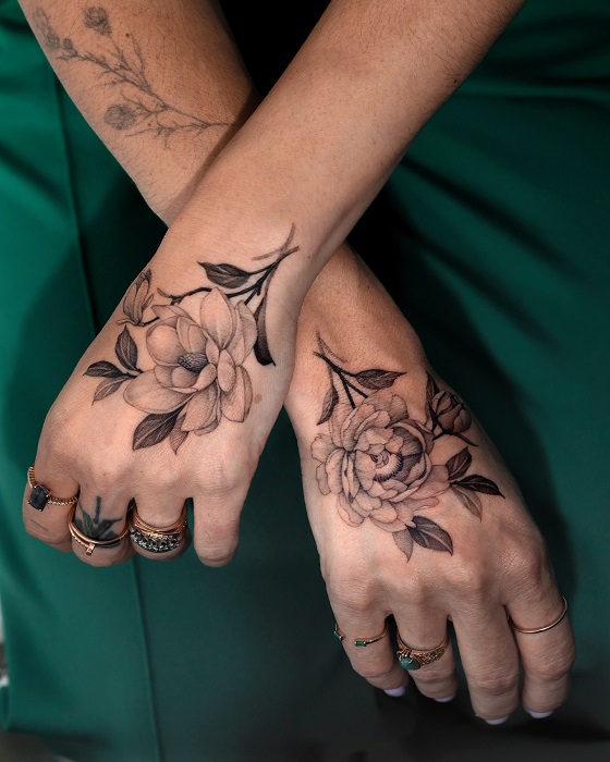 floral magnolia hand tattoos