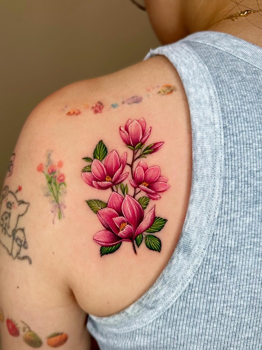 bright pink magnolia shoulder tattoo