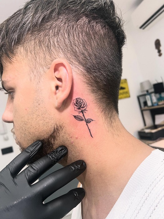 below the ear rose tattoo