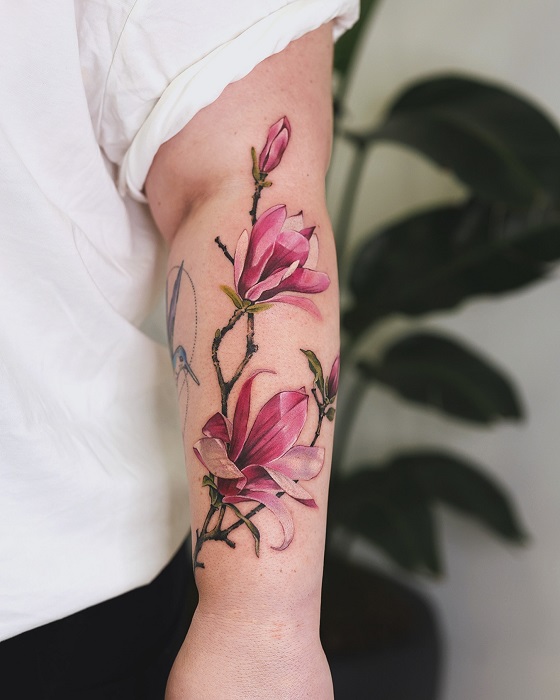 pink magnolia forearm tattoo
